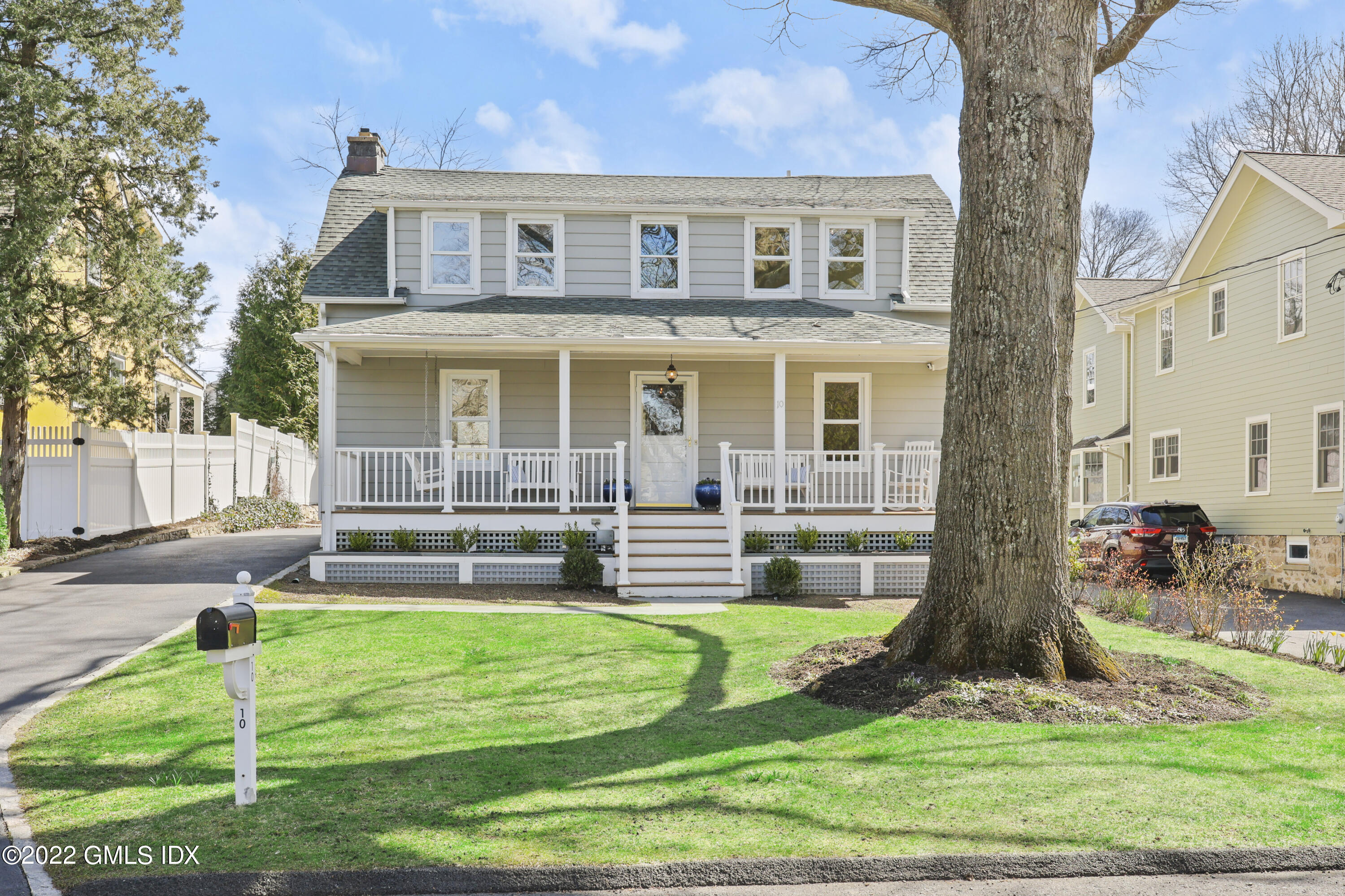 10 Butler Street Cos Cob, CT 06807 - Photo 1 of 43 a front view of house with a yard
