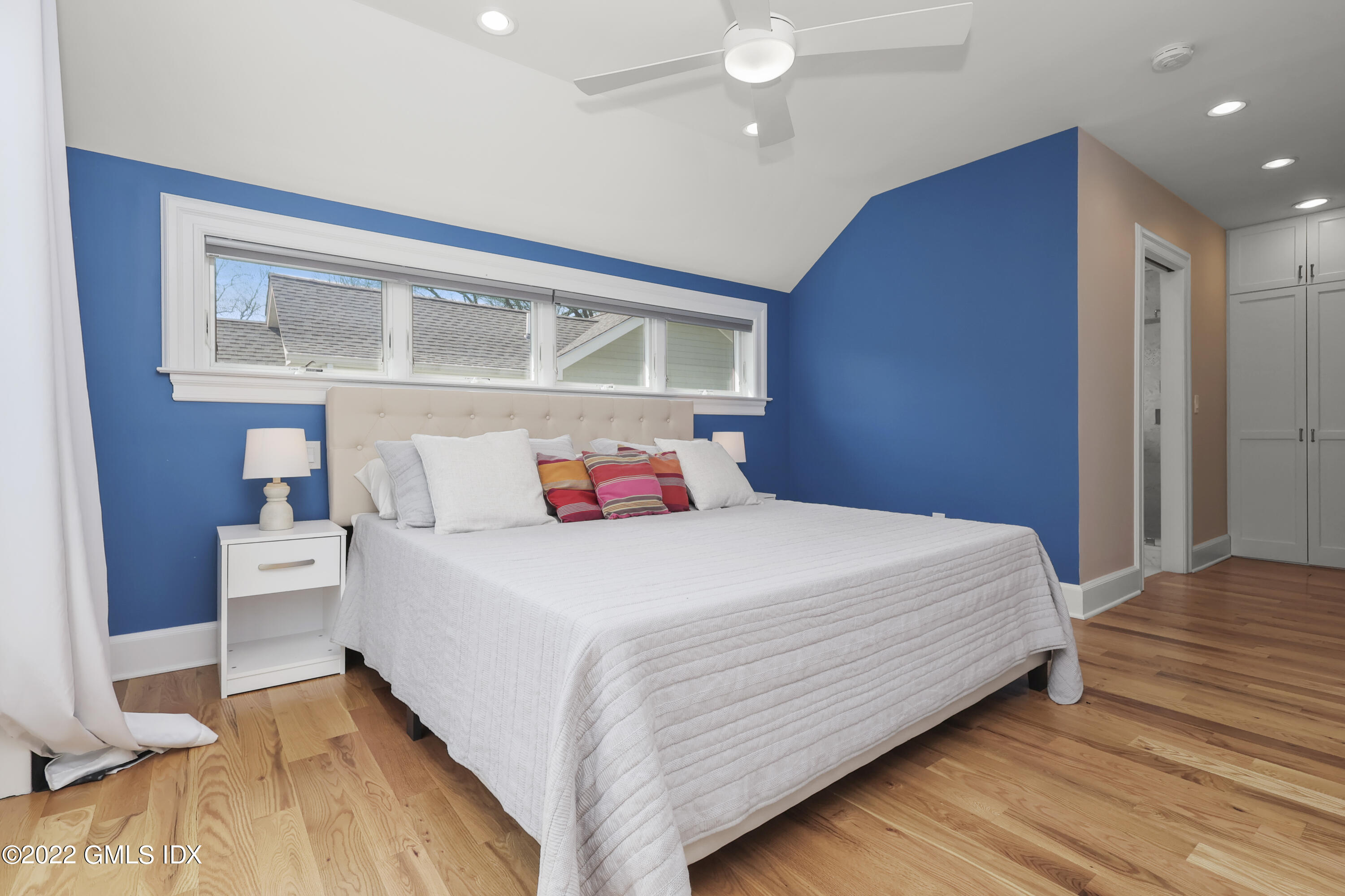 10 Butler Street Cos Cob, CT 06807 - Photo 16 of 43 a bedroom with a bed and a window