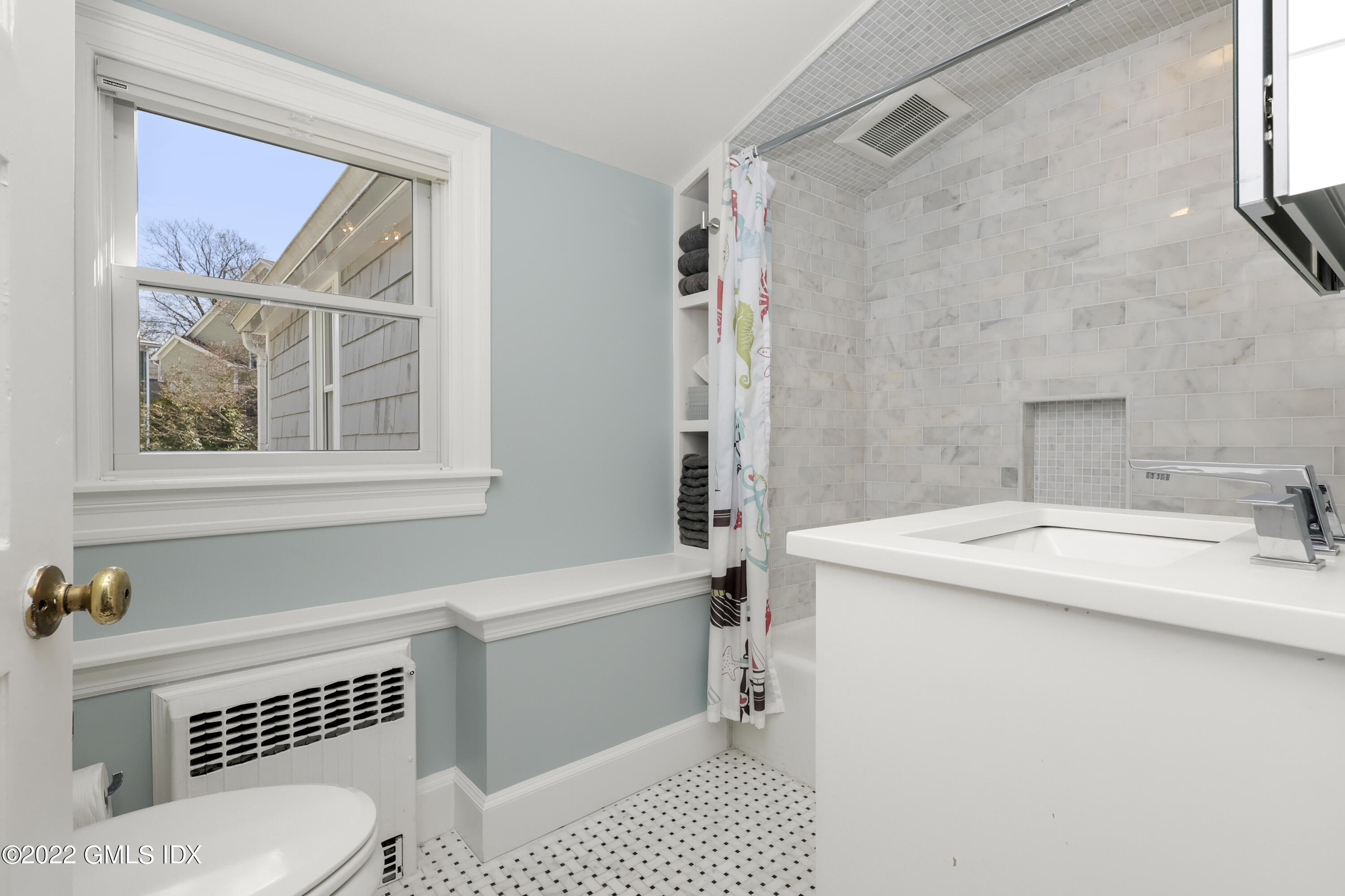 10 Butler Street Cos Cob, CT 06807 - Photo 24 of 43 a bathroom with a sink toilet and shower