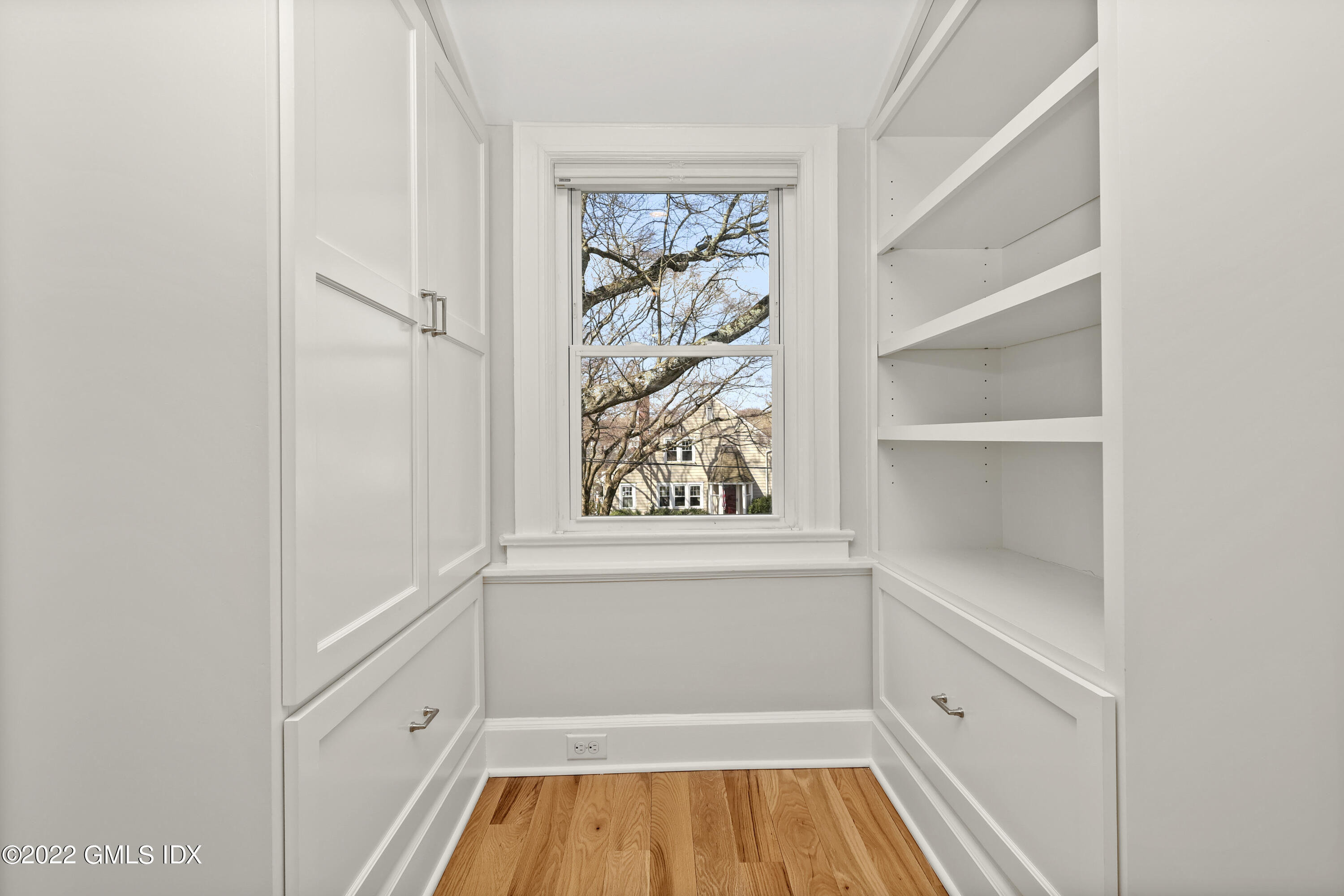 10 Butler Street Cos Cob, CT 06807 - Photo 27 of 43 a view of a kitchen with white cabinets and window