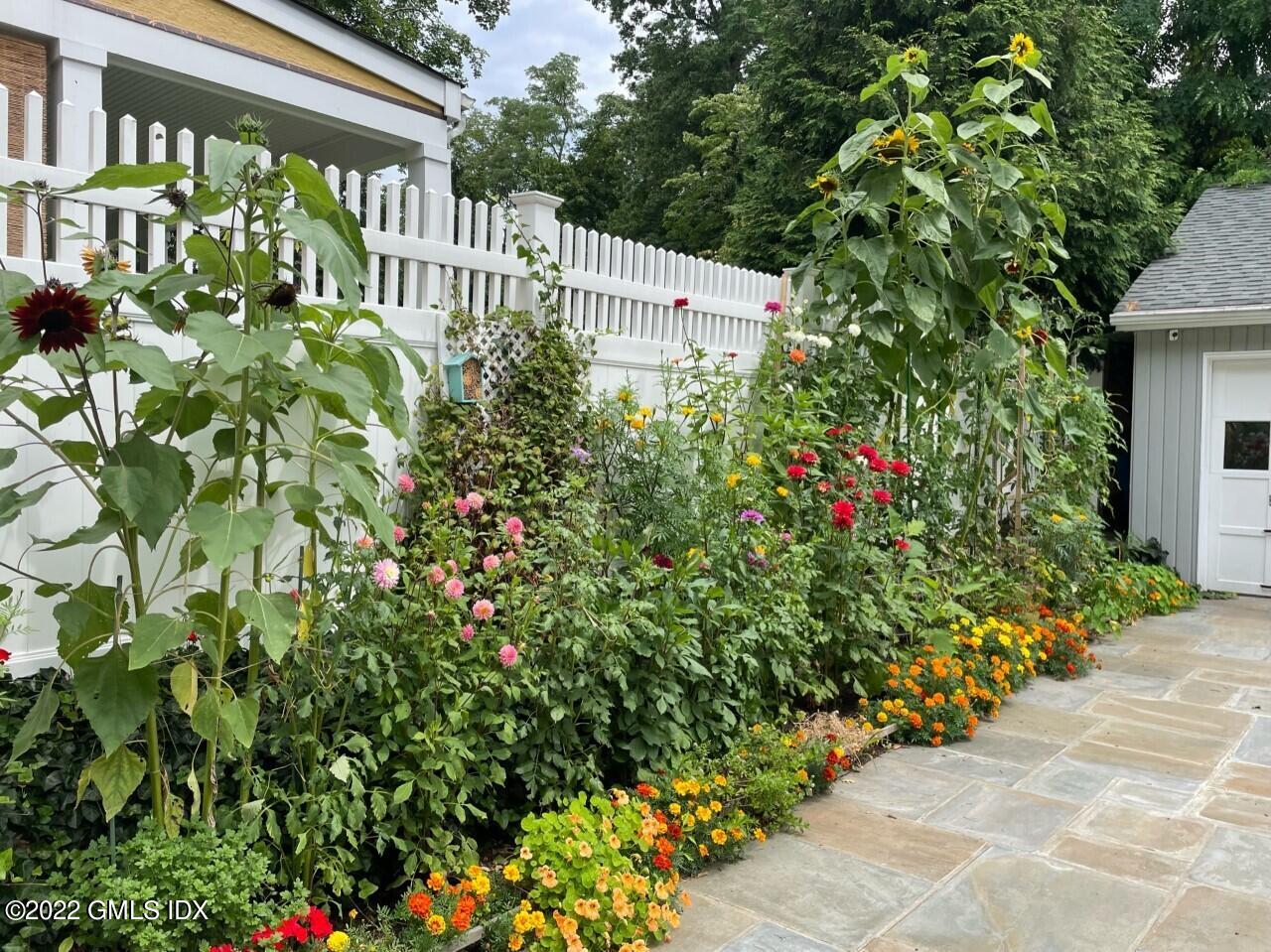 10 Butler Street Cos Cob, CT 06807 - Photo 41 of 43 a view of a house with a flower garden