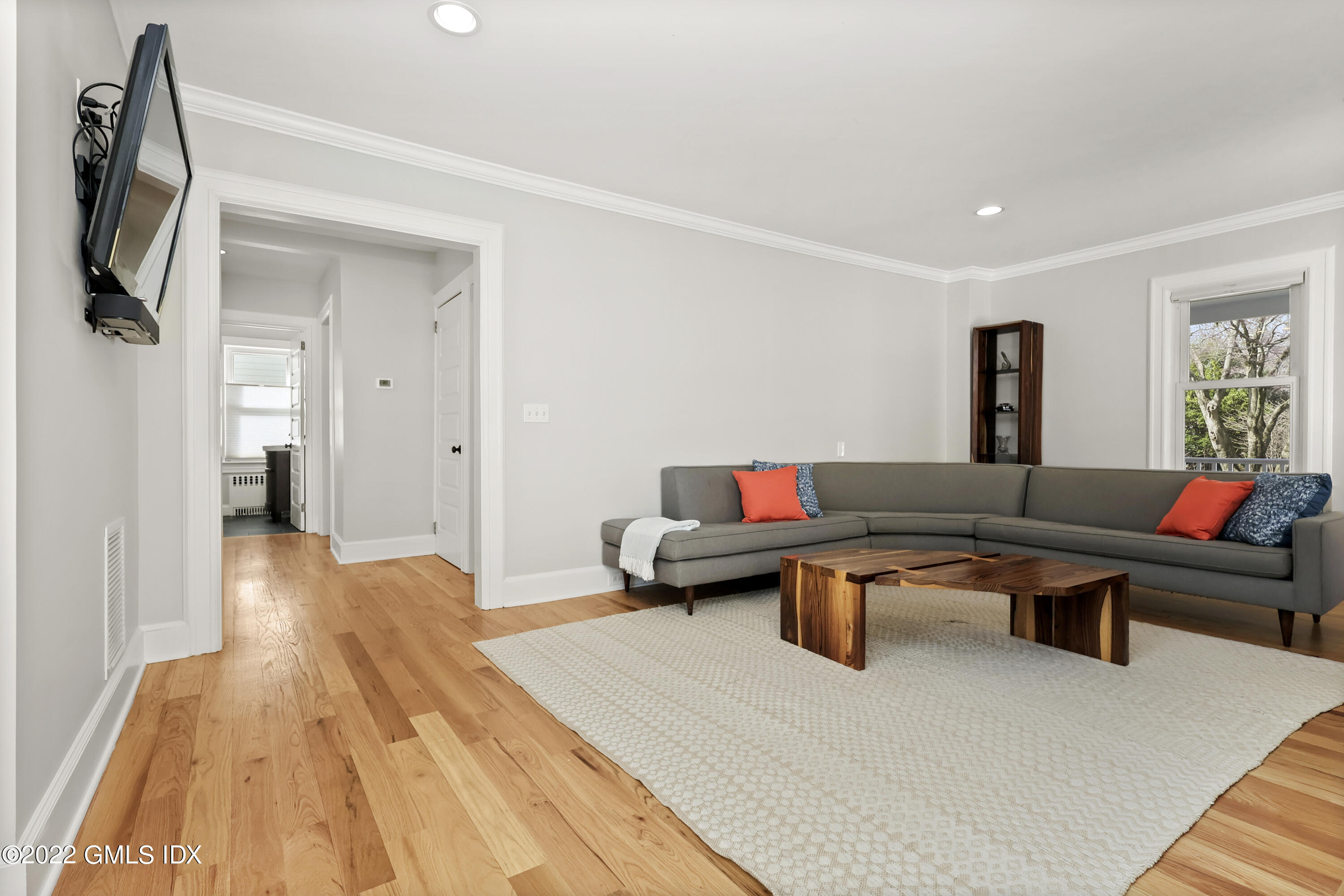 10 Butler Street Cos Cob, CT 06807 - Photo 9 of 43 a living room with furniture a rug and a wooden floor