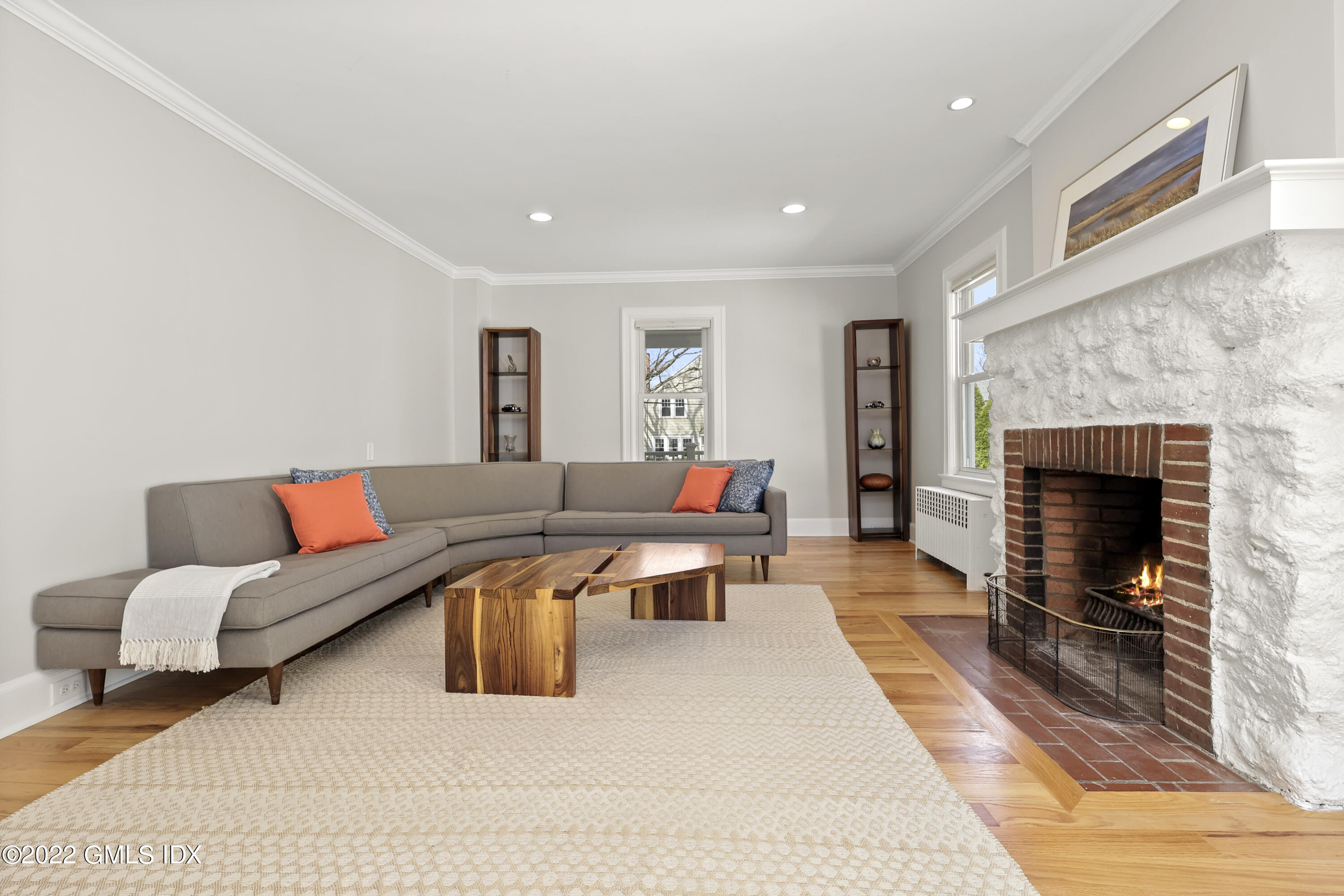 10 Butler Street Cos Cob, CT 06807 - Photo 10 of 43 a living room with furniture and a fireplace