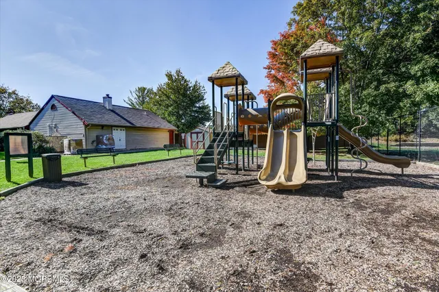 a house with trees in the background