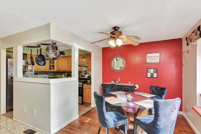 a view of a dining room with furniture and chandelier
