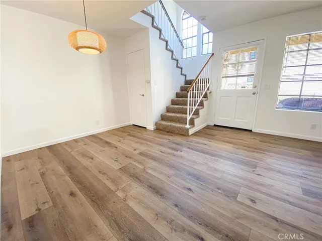 a kitchen with a refrigerator and a sink
