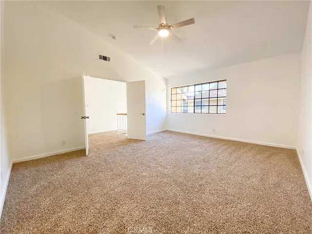 a view of a livingroom with wooden cabinets