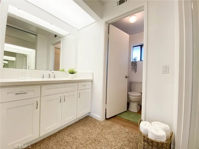 a view of a swimming pool with a patio and fire pit