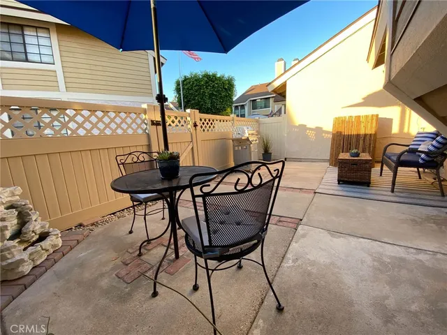 a view of an outdoor sitting area with furniture
