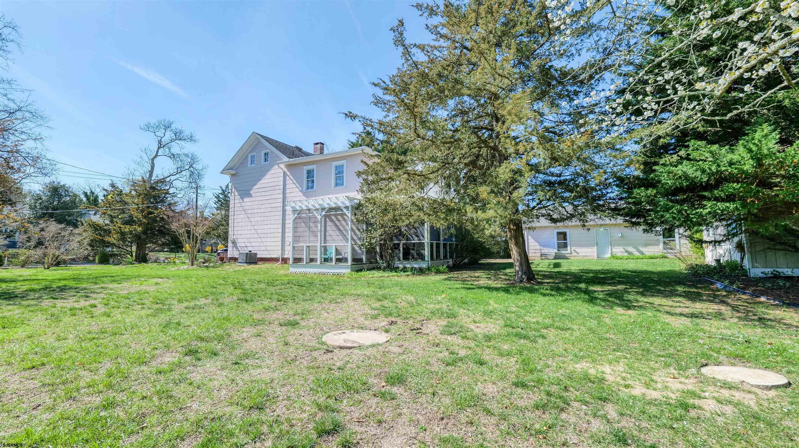 418 North Shore Road Beesleys Point, NJ 08223 - Photo 3 of 36 a view of a house with yard and a tree