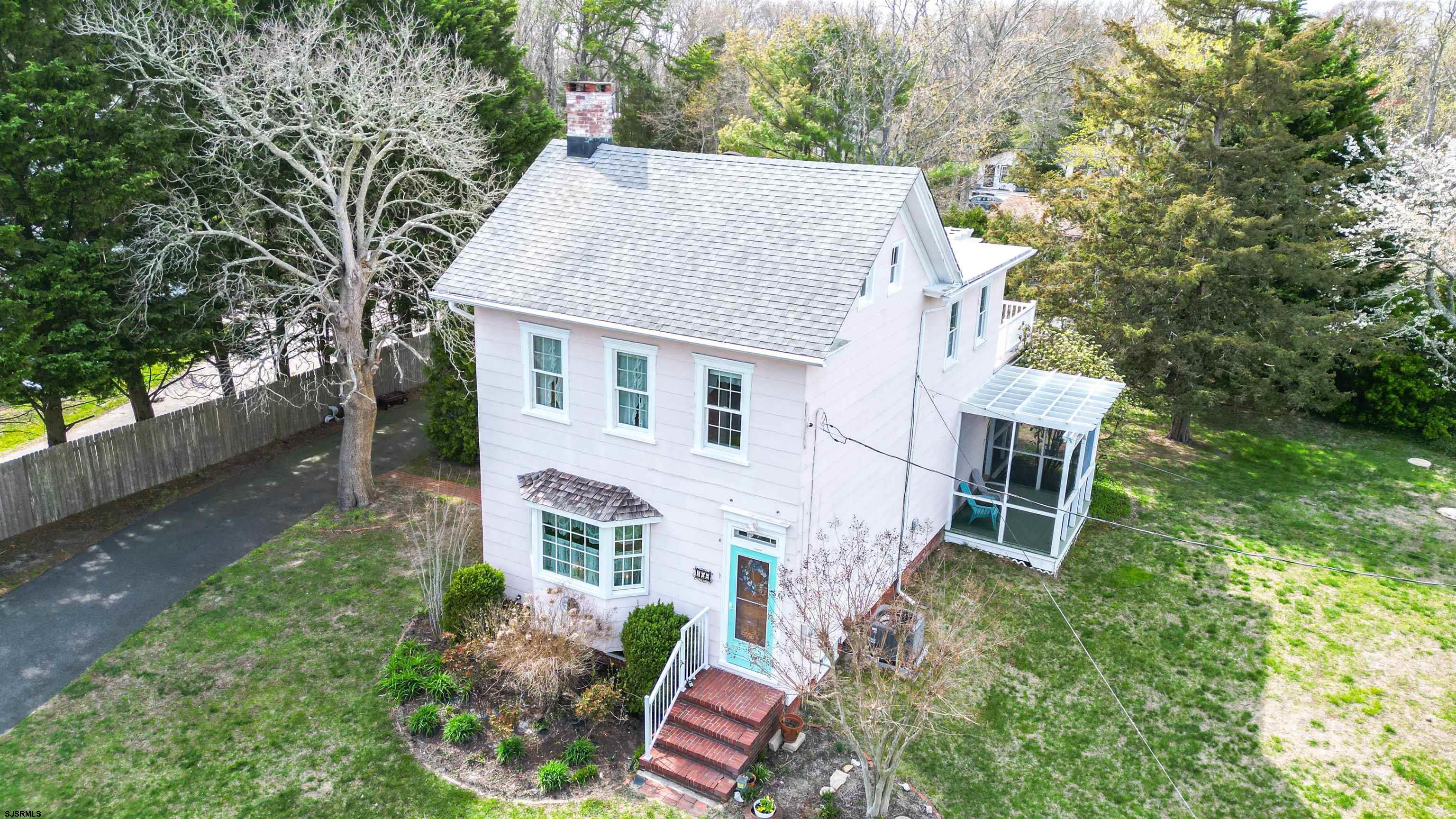 418 North Shore Road Beesleys Point, NJ 08223 - Photo 9 of 36 a aerial view of a house with a yard and potted plants