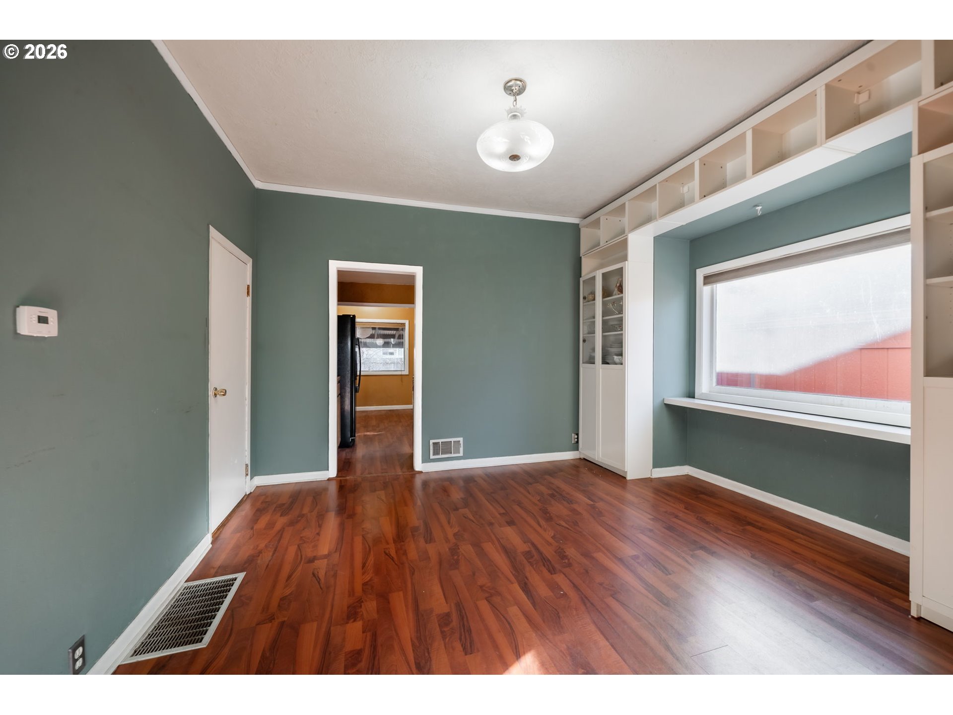 360 Northeast 75th Avenue Portland, OR 97213 - Photo 11 of 36 a view of an empty room with wooden floor and windows