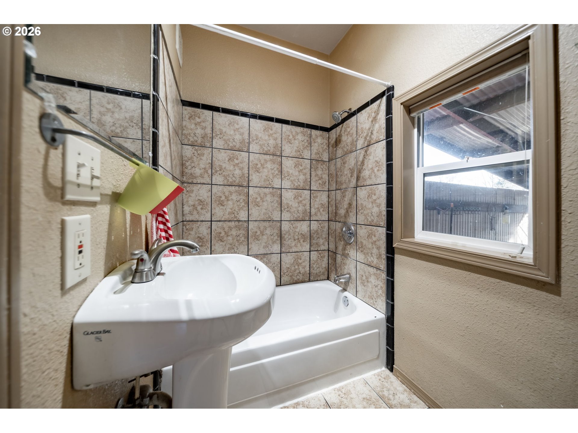 360 Northeast 75th Avenue Portland, OR 97213 - Photo 15 of 36 a bathroom with a sink and a mirror