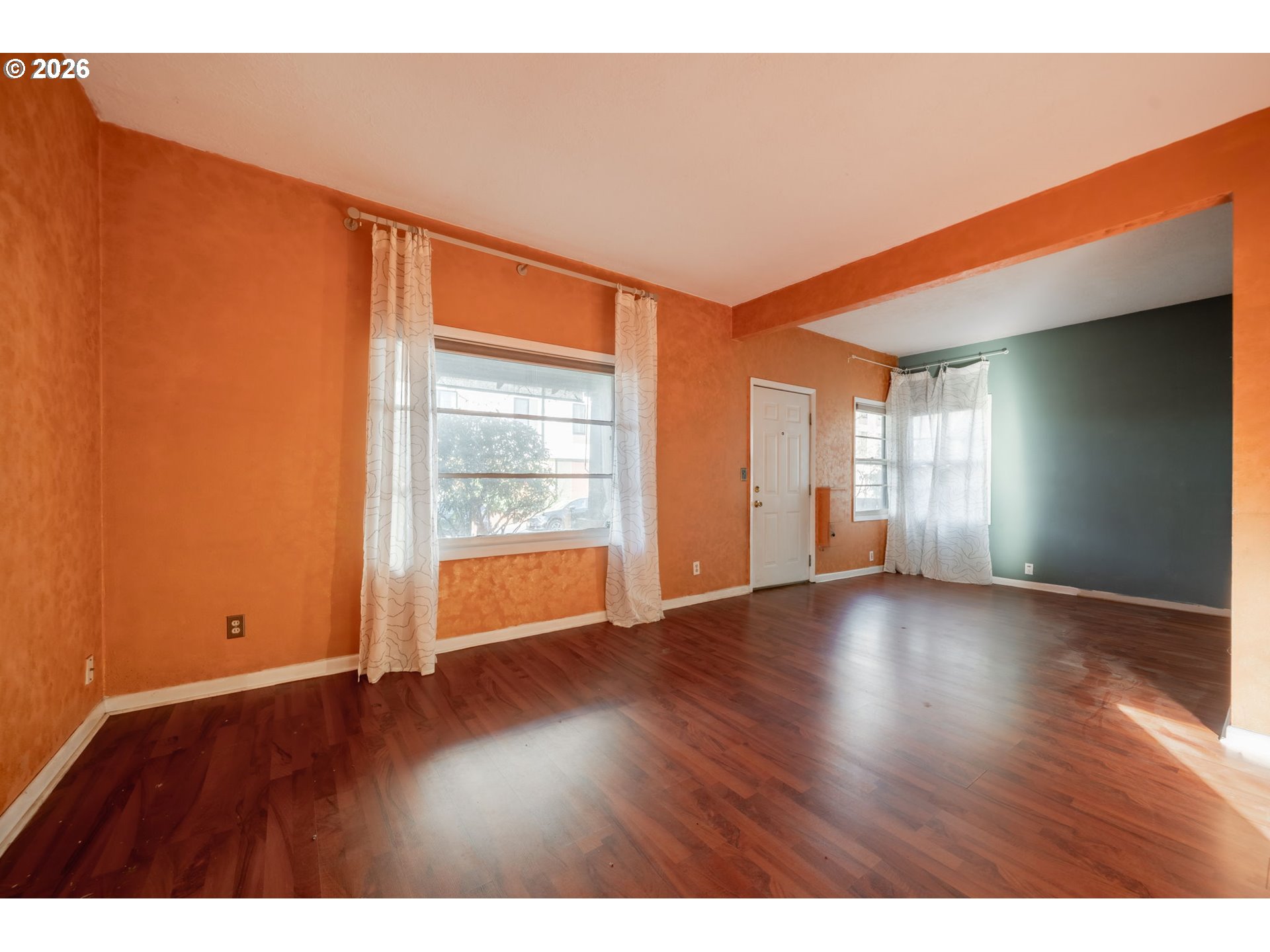 360 Northeast 75th Avenue Portland, OR 97213 - Photo 5 of 36 a view of empty room with wooden floor and fan