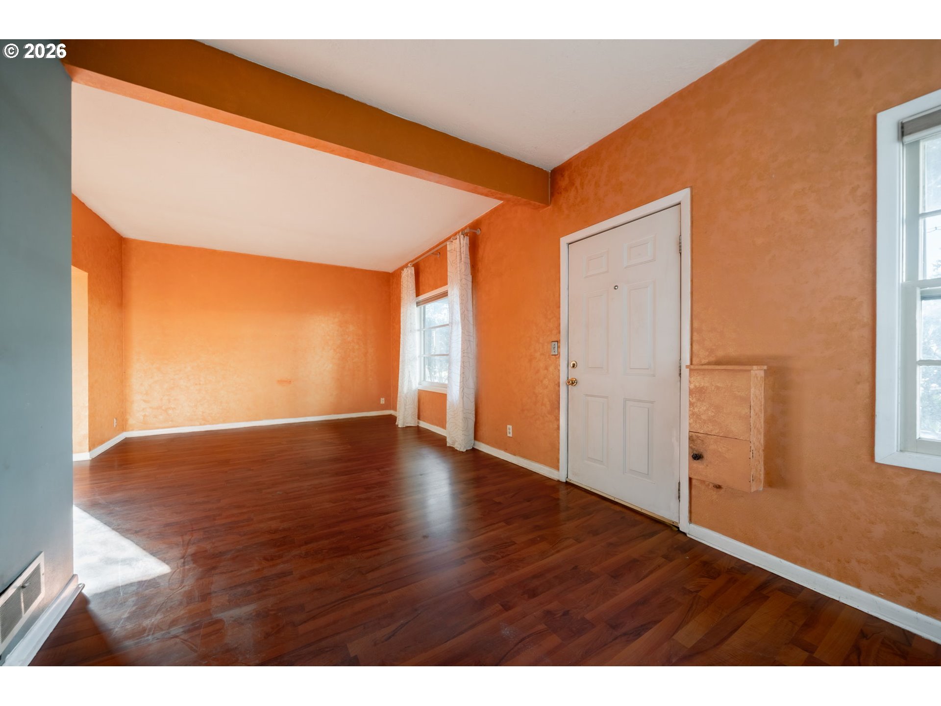 360 Northeast 75th Avenue Portland, OR 97213 - Photo 6 of 36 a view of an empty room with wooden floor and a window