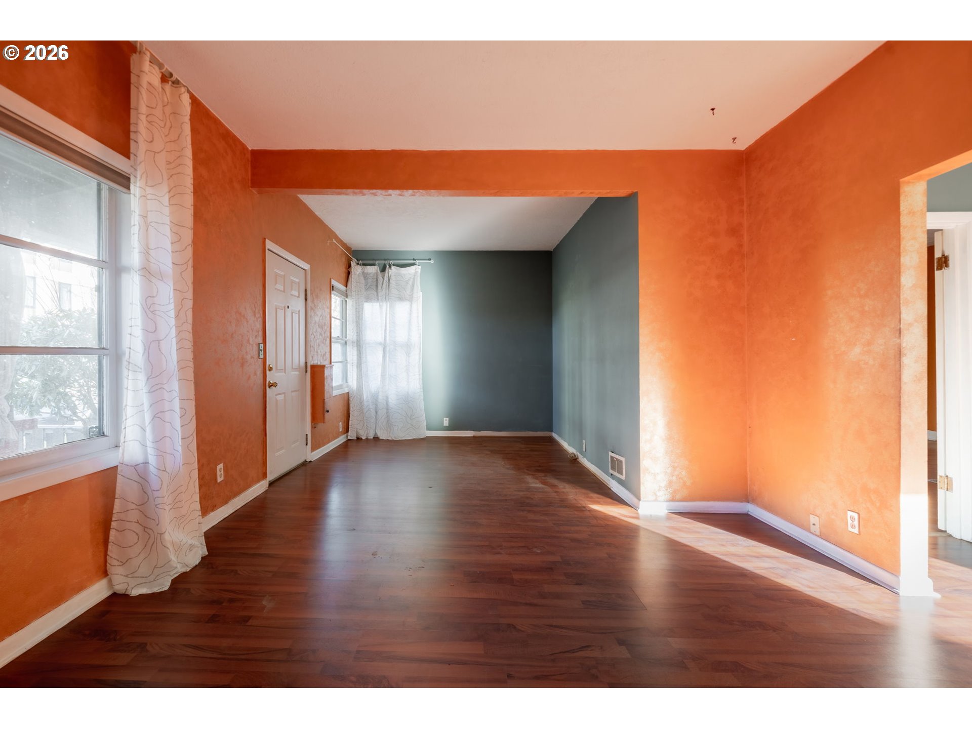 360 Northeast 75th Avenue Portland, OR 97213 - Photo 8 of 36 a view of an empty room with wooden floor and a window