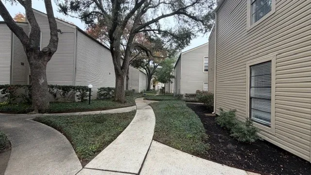 a view of a back yard of the house