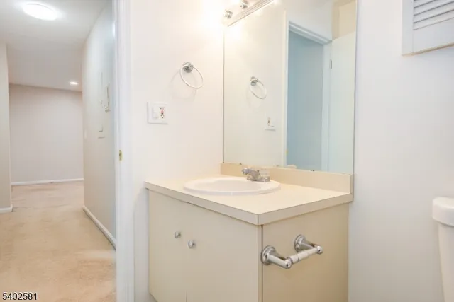 a bathroom with a sink a mirror and a shower