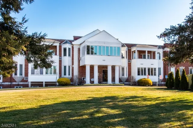 a front view of a house with swimming pool and porch