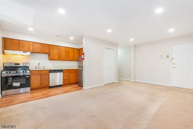 a view of a kitchen with a sink and microwave