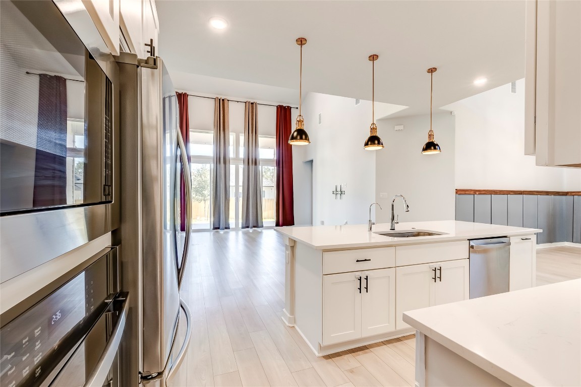129 Cotton Tree Terrace Dripping Springs, TX 78620 - Photo 15 of 40 a bathroom with a double vanity sink and mirror