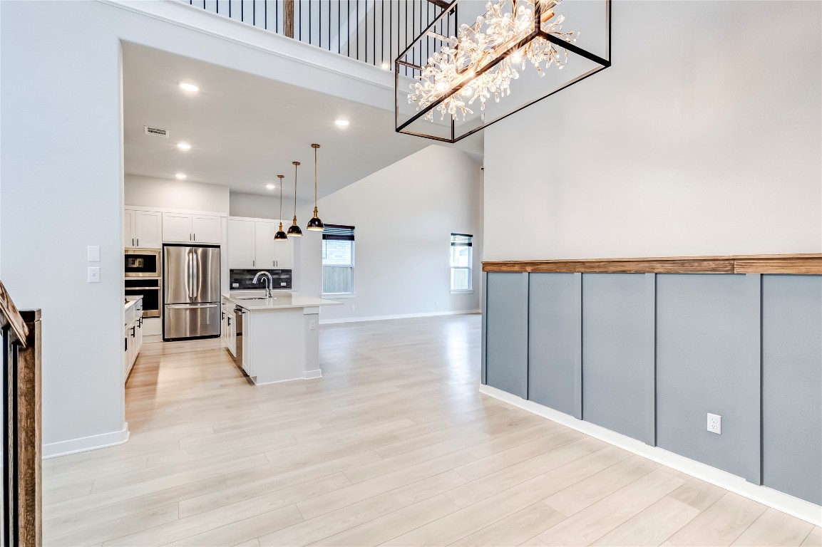 129 Cotton Tree Terrace Dripping Springs, TX 78620 - Photo 40 of 40 a view of a kitchen with furniture and wooden floor
