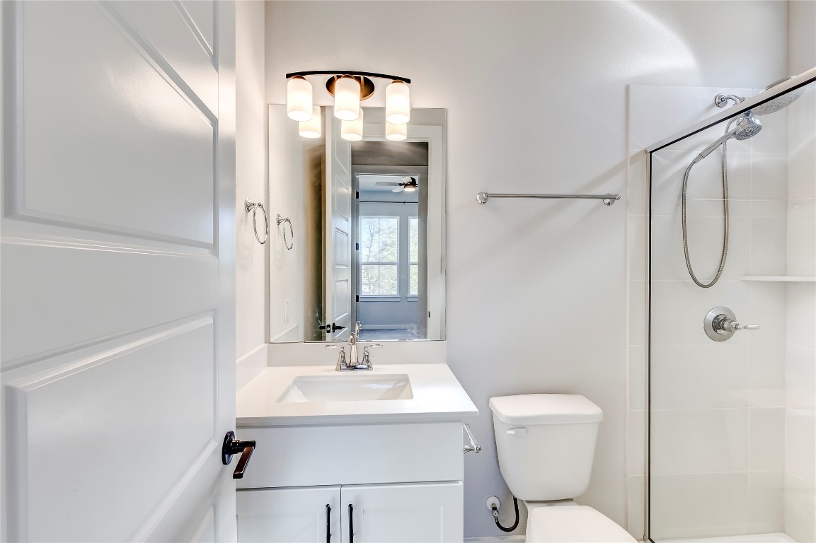 129 Cotton Tree Terrace Dripping Springs, TX 78620 - Photo 25 of 40 a bathroom with a sink toilet and shower