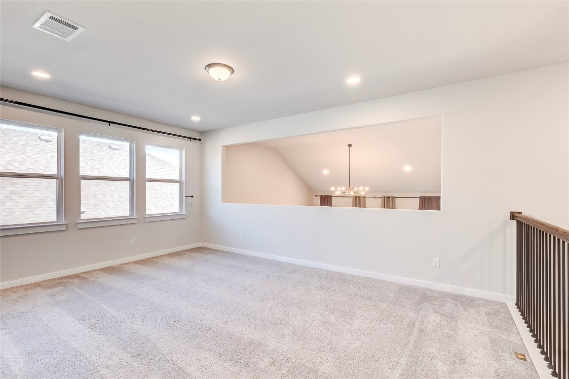 129 Cotton Tree Terrace Dripping Springs, TX 78620 - Photo 26 of 40 wooden floor in an empty room with a window