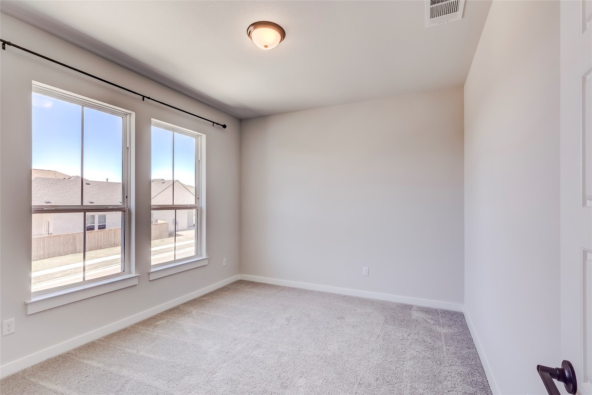 129 Cotton Tree Terrace Dripping Springs, TX 78620 - Photo 29 of 40 an empty room with windows