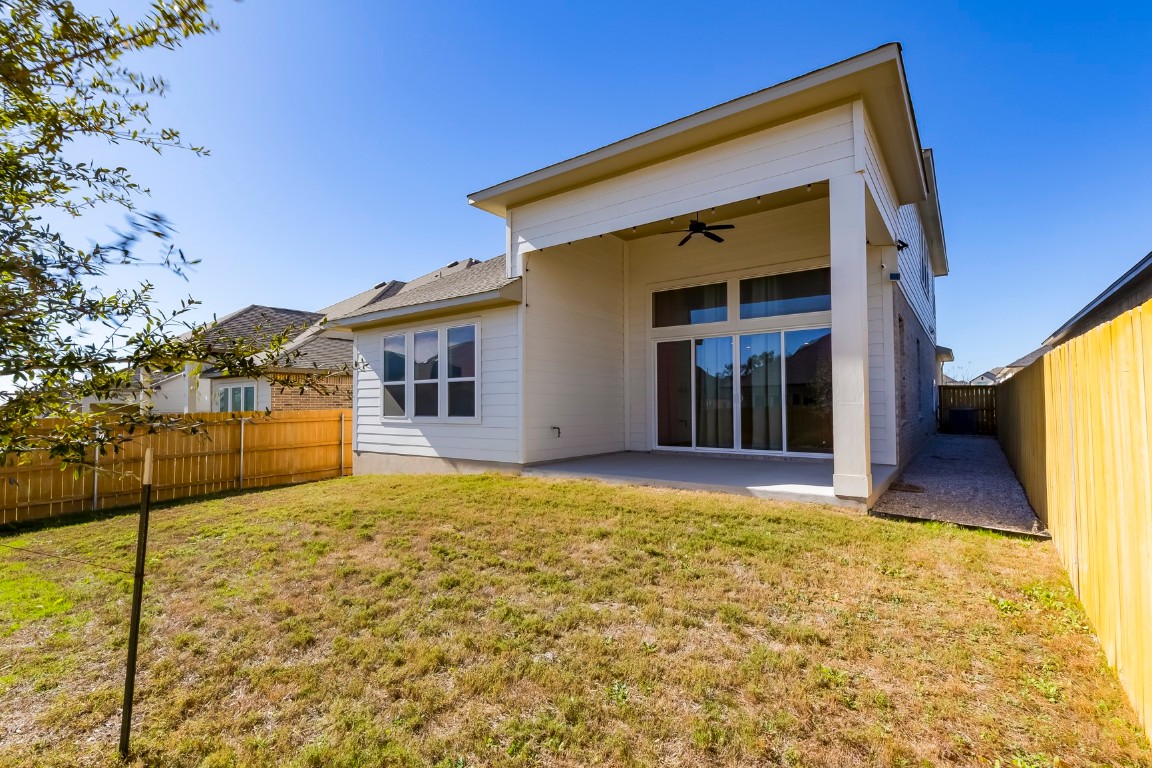 129 Cotton Tree Terrace Dripping Springs, TX 78620 - Photo 36 of 40 a view of house with backyard porch
