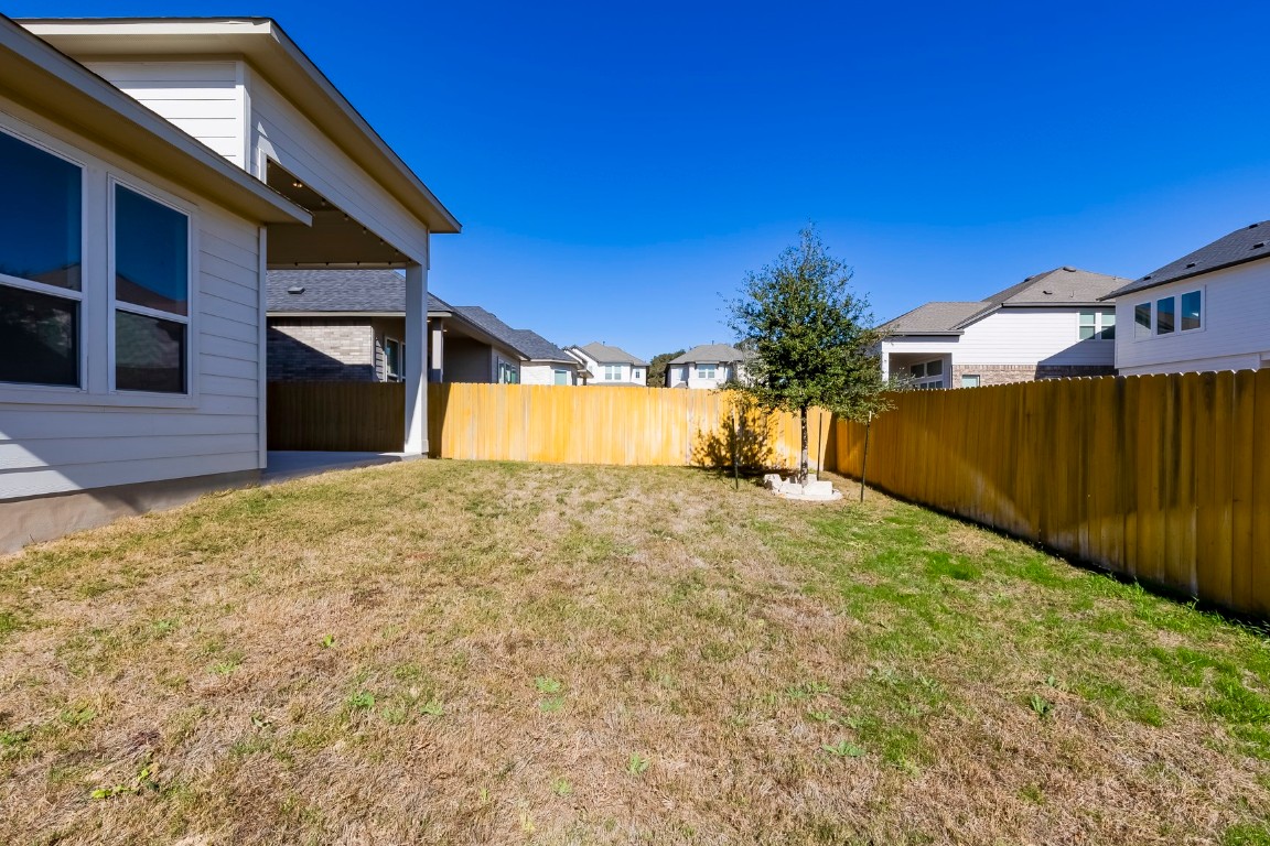 129 Cotton Tree Terrace Dripping Springs, TX 78620 - Photo 37 of 40 a view of a backyard