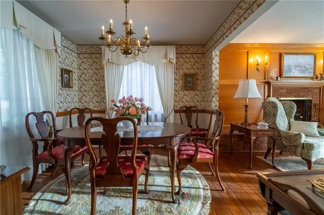 a kitchen with stainless steel appliances granite countertop a refrigerator a stove and a sink