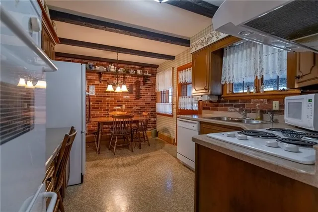 a living room with furniture a lamp and a fireplace