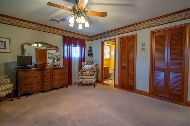 a bed room with a bed and a television