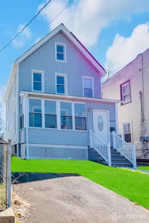 a brick building with a small yard and a small yard