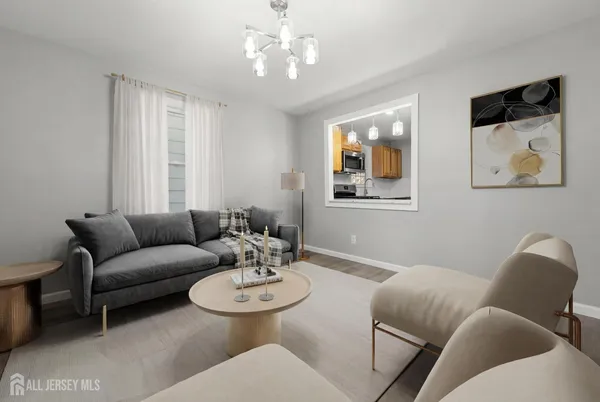 a living room with furniture and a chandelier