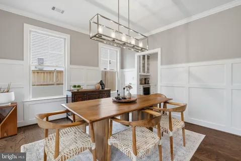 a view of a dining room with furniture and window
