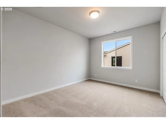 a bathroom with a granite countertop sink toilet a mirror and shower