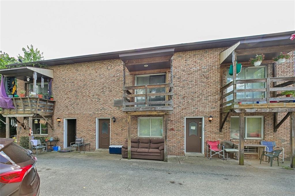 80 Colony Drive Irwin, PA 15642 - Photo 2 of 11 a front view of a building with an outdoor seating