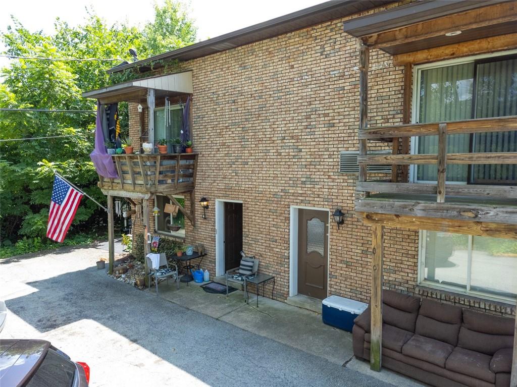 80 Colony Drive Irwin, PA 15642 - Photo 5 of 11 a backyard of a house with barbeque oven table and chairs