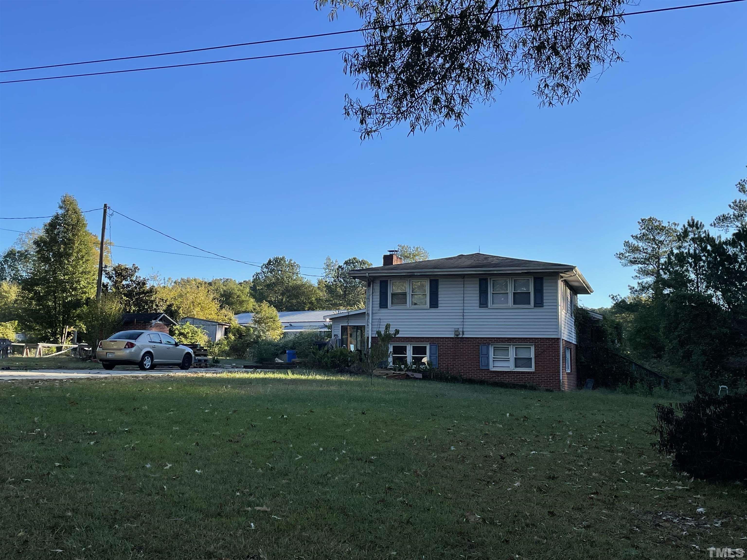 6605 Old Stage Road Raleigh, NC 27603 - Photo 13 of 13 a view of a house with a big yard