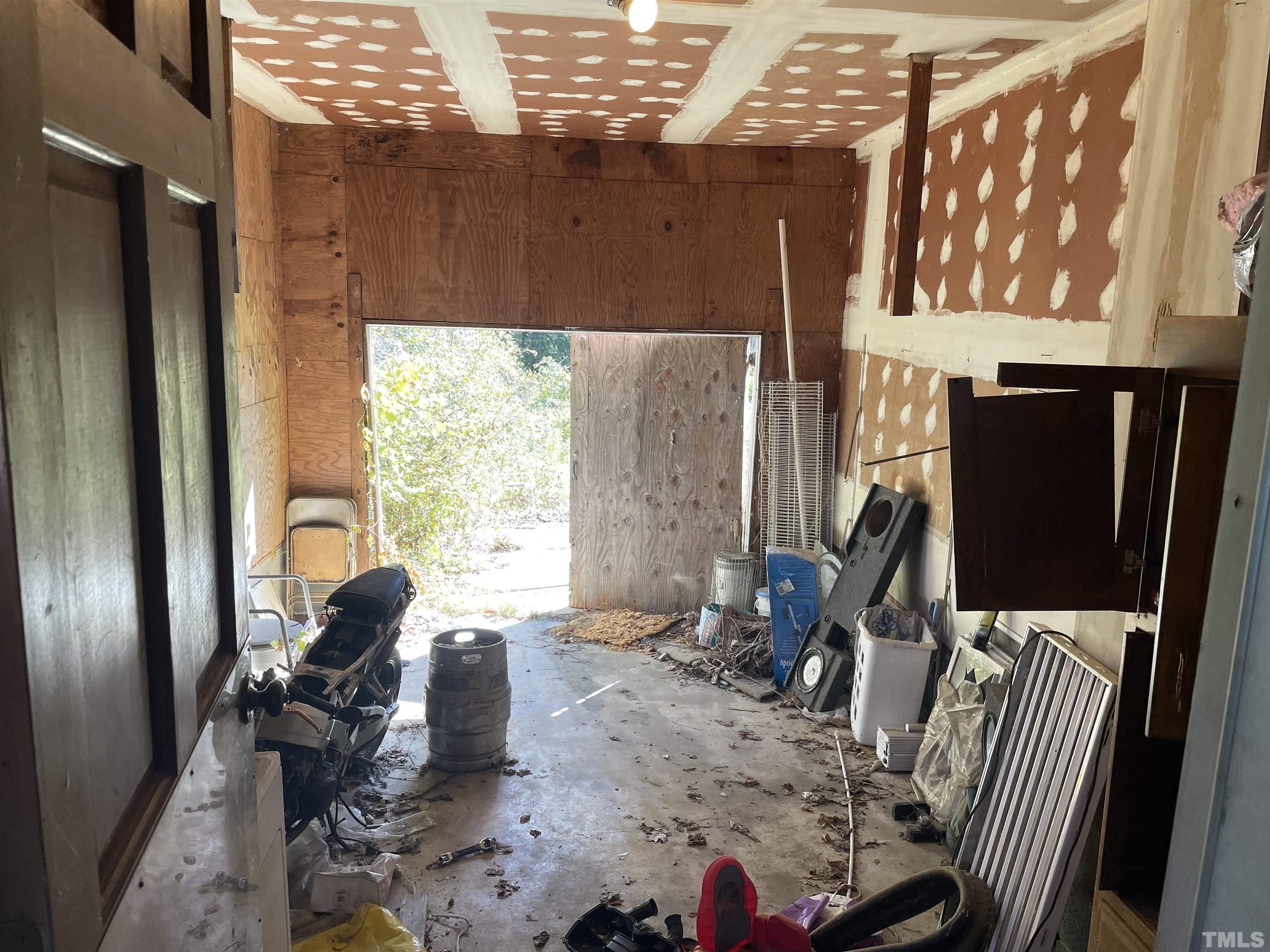 6605 Old Stage Road Raleigh, NC 27603 - Photo 7 of 13 a living room with furniture a large window with wooden floor