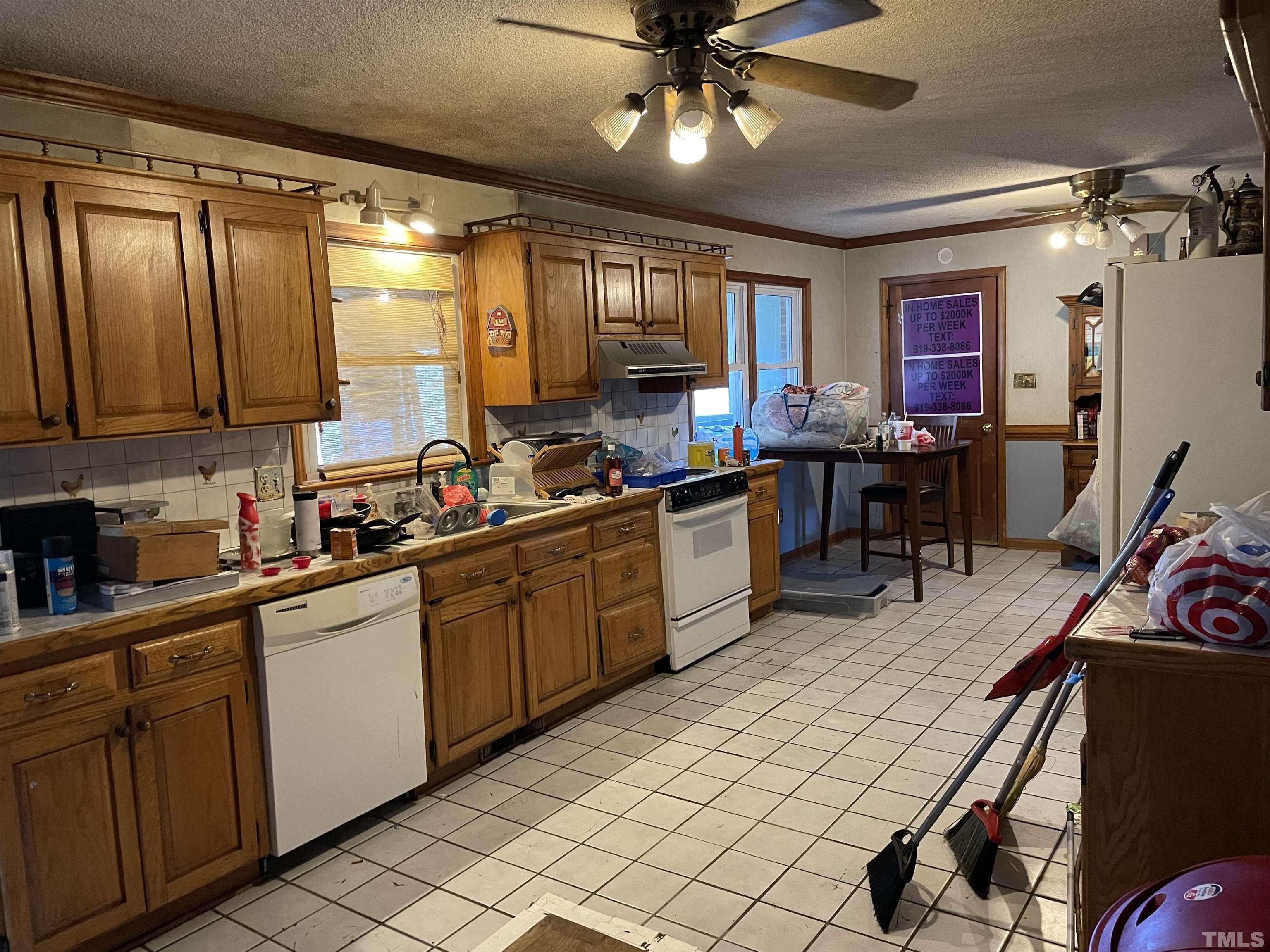 6605 Old Stage Road Raleigh, NC 27603 - Photo 8 of 13 a kitchen with sink cabinets and window