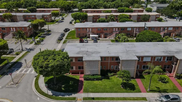 an aerial view of a house with garden space and outdoor seating