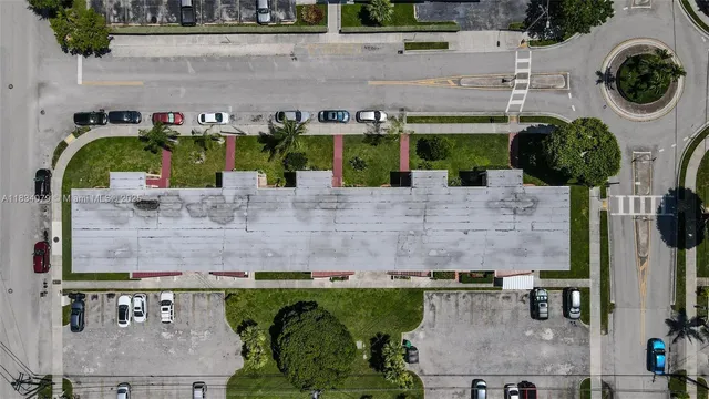 an aerial view of a house with a swimming pool