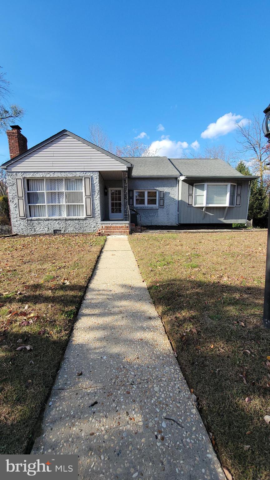 a front view of a house with yard