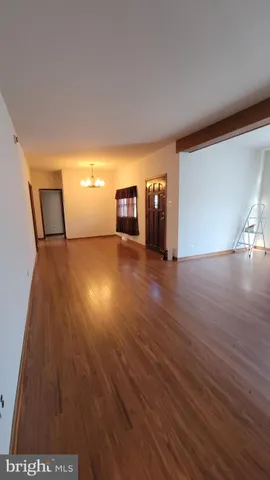 a view of a livingroom with wooden floor