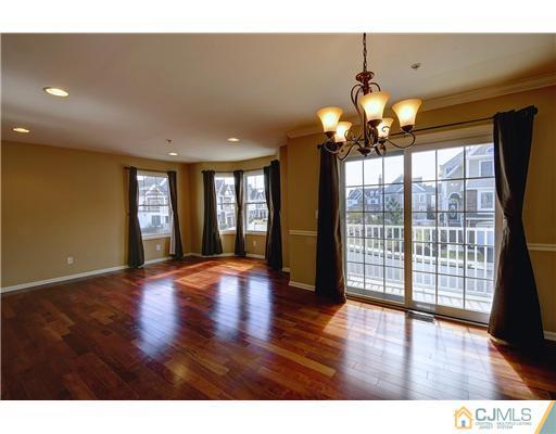 54 Raritan Reach Road South Amboy, NJ 08879 - Photo 11 of 23 a view of an empty room with wooden floor and a window