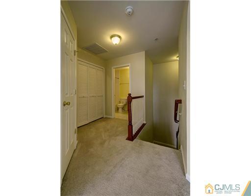 54 Raritan Reach Road South Amboy, NJ 08879 - Photo 15 of 23 a view of a hallway with a white cabinet