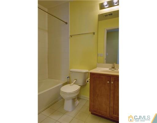 54 Raritan Reach Road South Amboy, NJ 08879 - Photo 21 of 23 a bathroom with a sink toilet and shower